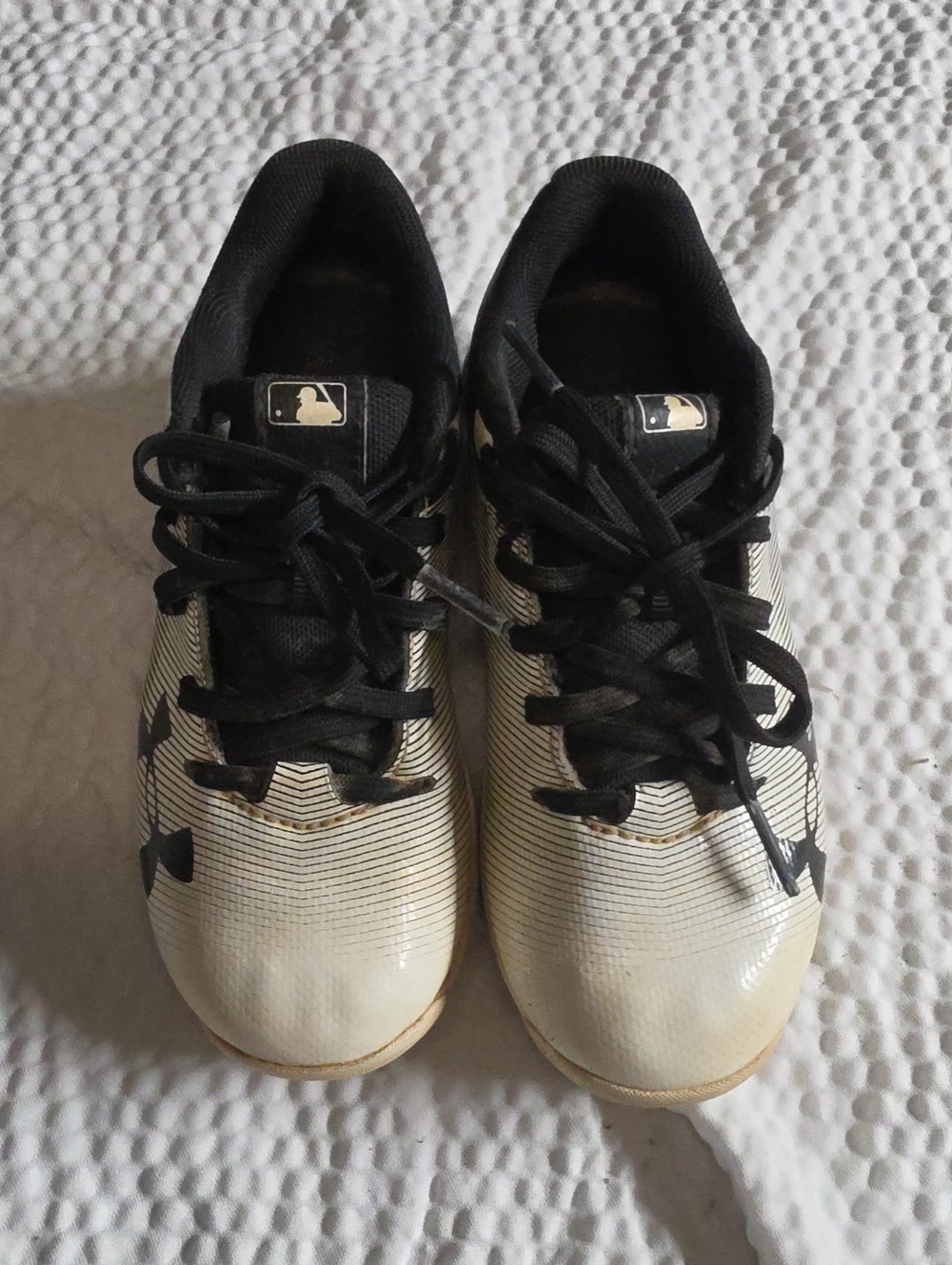 Under Armour Kids White and Black Athletic Cleats